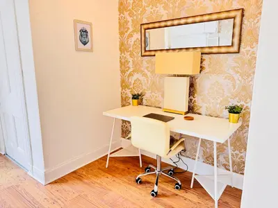 a desk in a room with a mirror at THE RESTING LION - Gourock Town Center Holiday Home Apartment in Gourock