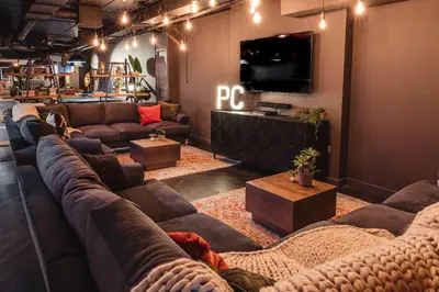 a living room with couches and a flat screen tv at For Students Only Portsburgh Court Edinburgh in Edinburgh