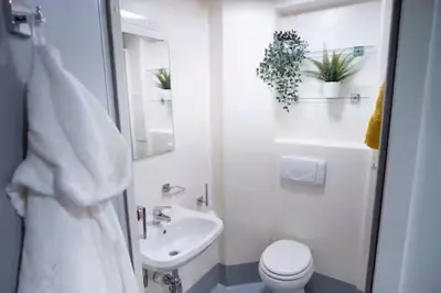 a white bathroom with a toilet and a sink at For Students Only Portsburgh Court Edinburgh in Edinburgh