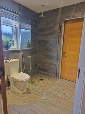 a bathroom with a toilet and a shower at Beolary in Oban