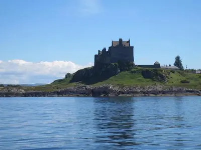 a castle on an island in the water at Beolary in Oban