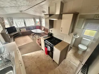 an overhead view of a kitchen with a stove top oven at Delta, Bromley 4-Bedroom Located in Uddingston, Glasgow at Maryville Caravan Site in Uddingston