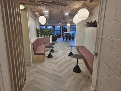 a lobby with benches and tables in an office at For Student Only Student Roost Gibson Street in Glasgow