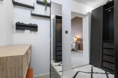 a room with white walls and a hallway at Extravagant 6 Bed Victorian Townhouse with Hot Tub in Glasgow