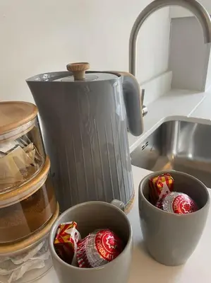 two bowls on a counter next to a kitchen sink at 1 Smithhills Sleeps 5 Central and Spacious in Paisley