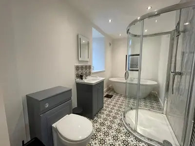 a bathroom with a toilet and a sink and a shower at Stunning Cosy Cottage in Historic Moffat - Pass the Keys in Moffat