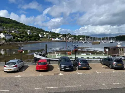 a group of cars parked in a parking lot near a marina at Bielding View Tarbert Loch Fyne Argyll in Tarbert