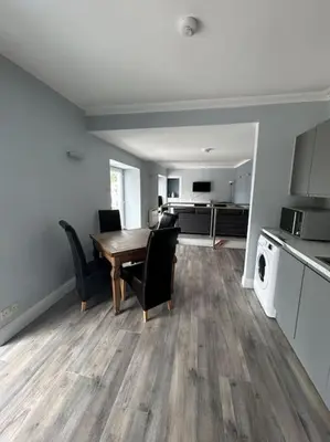a kitchen and dining room with a table and chairs at Bielding View Tarbert Loch Fyne Argyll in Tarbert