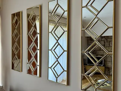 a row of mirrors on a wall at Rose Street flat in Edinburgh