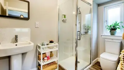 a bathroom with a shower and a sink at TheLodge in Arrochar