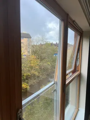 an open window with a view of a river at Riverview Retreat Shawlands in Mansewood