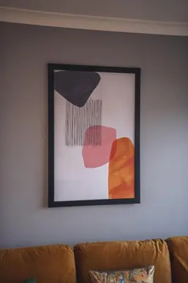 a picture on a wall above a couch at Franklin Place in East Kilbride