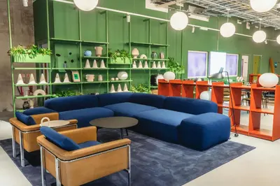 a living room with a blue couch and chairs at The Social Hub Glasgow Extended Stay in Glasgow