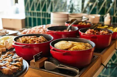 a buffet of different types of food on a table at The Social Hub Glasgow Extended Stay in Glasgow