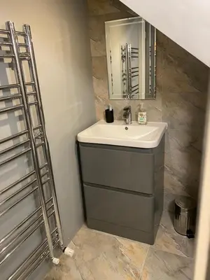 a bathroom with a sink and a mirror at The Barn in Hawkhead