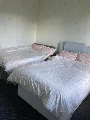 two beds sitting next to each other in a bedroom at Gilmore Flat in Edinburgh