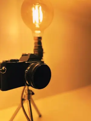 a camera on a tripod with a light on it at Central Designer Flat by Castle in Edinburgh
