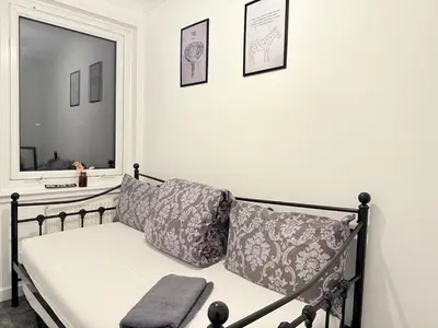 a couch in a room with a window at RF-Entire House-Central Scotland-Falkirk, Self-Check-in , Pet-friendly and with Parking in Falkirk