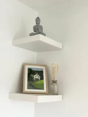 a shelf with a picture and a statue on top of it at KH-Entire House -Central Scotland, Self-Check-in , Pet-friendly and with Parking in Falkirk