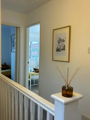 a room with a stairway with a vase on a table at KH-Entire House -Central Scotland, Self-Check-in , Pet-friendly and with Parking in Falkirk