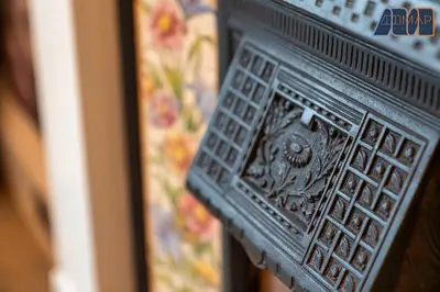 a close up of a carving on the side of a fireplace at Historic 3 Bed Private Parking Nr Railway Station in Wemyss Bay