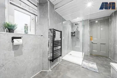 a bathroom with a shower and a toilet and a sink at Historic 3 Bed Private Parking Nr Railway Station in Wemyss Bay