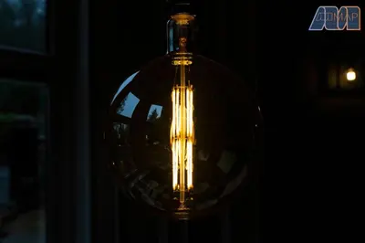 a light in a glass bottle in the dark at Historic 3 Bed Private Parking Nr Railway Station in Wemyss Bay