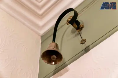 a copper pot hanging on a wall in a room at Historic 3 Bed Private Parking Nr Railway Station in Wemyss Bay