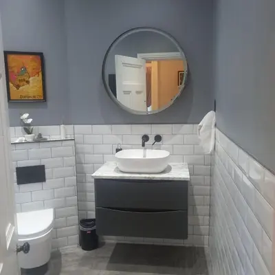 a bathroom with a sink and a mirror at Carvetii - Abbey View, 1st Floor Flat, City Centre in Dunfermline