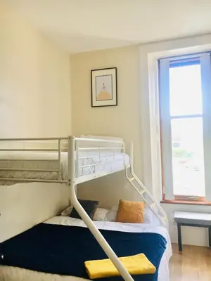a bedroom with a bunk bed and a window at VS-Entire Flat-Central Scotland-Falkirk, Self-Check-in , Pet-friendly with Parking in Falkirk