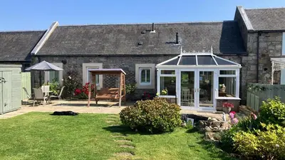 a house with a conservatory in a yard at 2 Bed in Rosyth oc-r30512 in Rosyth