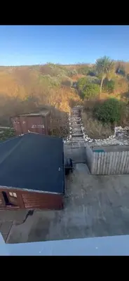 a ping pong table sitting on top of a building at Church Bay House in Rathlin Island