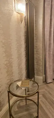a glass table with a book on it in a room at 2 Bedroom Sofa bed in livingroom Castle View 1st floor sleeps 6 in Edinburgh