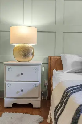 a bedroom with a bed and a lamp on a night stand at Central, Cozy 2BR-1BA-Haymarket - with Parking in Edinburgh