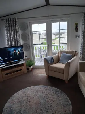 a living room with a couch and a television at St Nicholas Number 5 in Turnberry