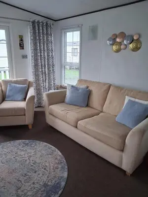 a living room with a couch and two chairs at St Nicholas Number 5 in Turnberry