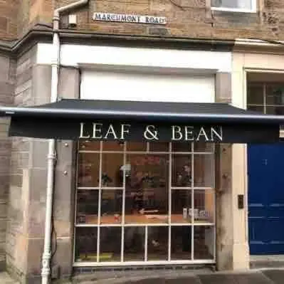 a store front with a black awning with the words lead and beam at Stunning refurbished main door Marchmont apartment in Edinburgh