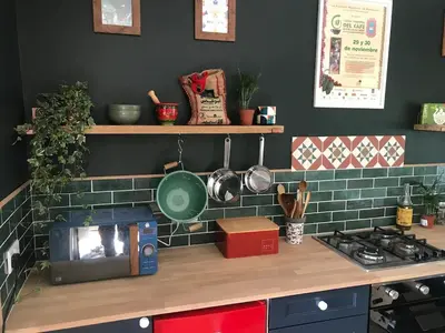 a kitchen with a counter top with a stove at Gorgeous boutique off-grid cottage near Peebles in Peebles