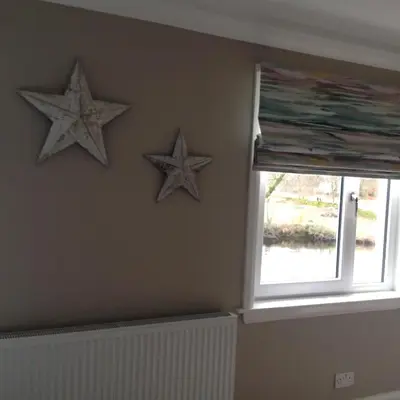 two stars on a wall next to a window at Lovely Riverside Holiday Home in Callander
