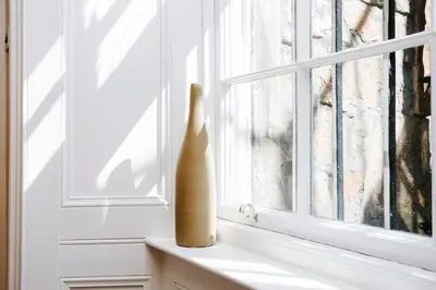 a vase sitting on a window sill at Large Central 3 Bed 3 Bath Apartment - New Town in Edinburgh