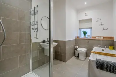 a bathroom with a shower and a sink and a toilet at 3 Bed in Fearnan oc-s29984 in Chesthill