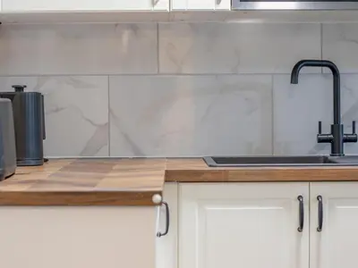 a kitchen with a sink and a counter top at Happy Haven Home, West End - Pass the Keys in Glasgow