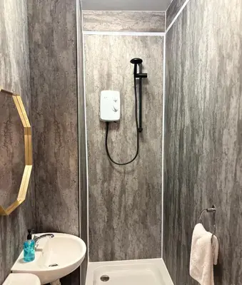 a bathroom with a shower and a sink at Piccolo in Glasgow