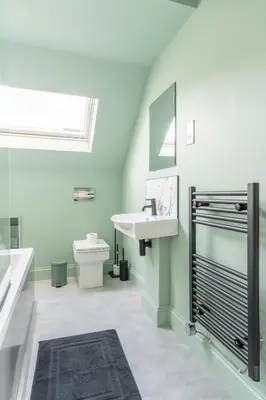 a bathroom with a sink and a toilet at Prime Stay Apartments in Paisley
