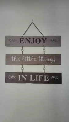 a wooden sign with the words enjoy the little things in life at Cosy 2 bed home Glasgow South in Cathcart