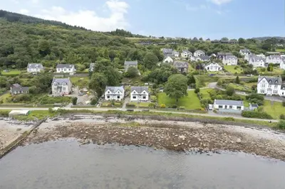 an aerial view of a residential neighborhood with houses at Greenwood South - Luxury beachfront home with log burner in Kames