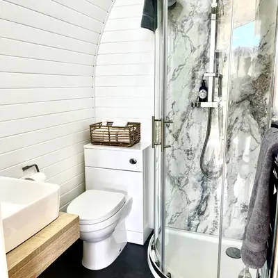 a bathroom with a toilet and a shower at Heather Pod in Perth