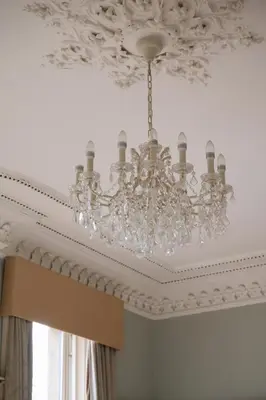 a chandelier hanging from a ceiling in a room at 7 Crown Gardens Glasgow in Glasgow