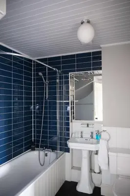 a bathroom with a sink and a tub and a toilet at 7 Crown Gardens Glasgow in Glasgow