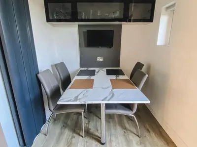a conference room with a table and chairs at 20min to Edinburgh City Centre Scotland Gateway in Cowdenbeath